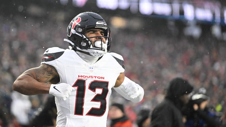 Christian Kirk celebrating a touchdown during a playoff game at Gillette Stadium.
