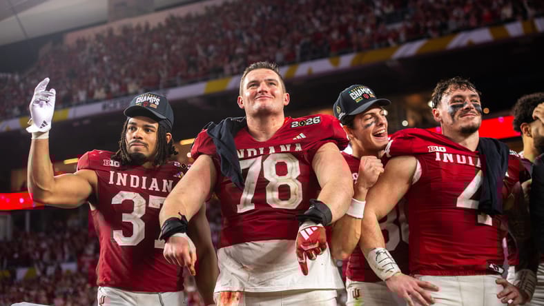 Indiana players celebrate on the podium after winning the national championship at Hard Rock Stadium. Vikings early draft crushes.