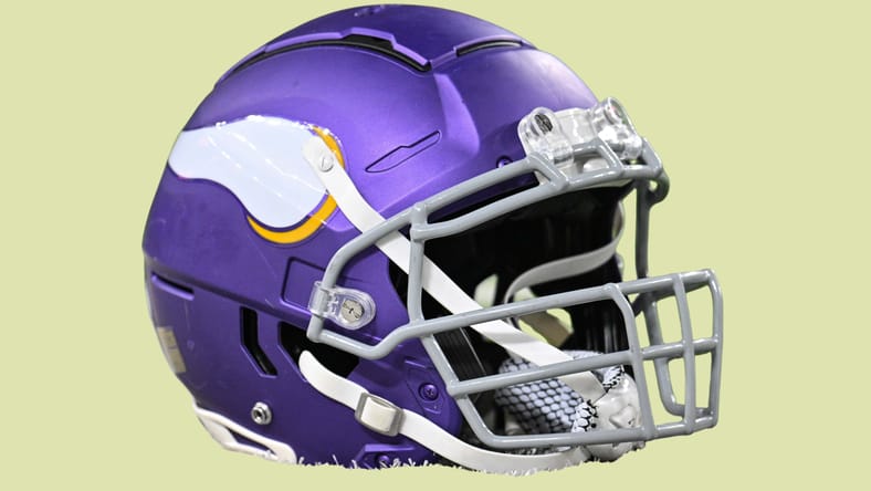 Minnesota Vikings helmet sits on the field before a game at U.S. Bank Stadium.