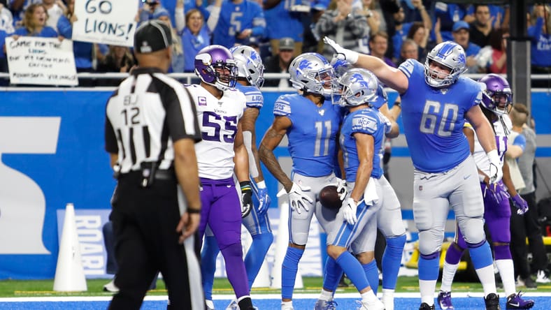 Lions center Graham Glasgow celebrates a touchdown against the Vikings