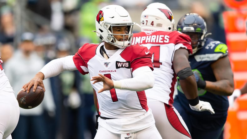 Kyler Murray passing the ball against the Seahawks during a Cardinals game in Seattle. Kyler Murray Vikings.
