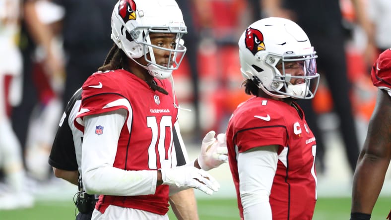 Kyler Murray throwing to DeAndre Hopkins during a Cardinals game versus Washington. DeAndre Hopkins Vikings.