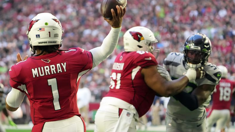 Kyler Murray throwing a pass against the Seahawks at State Farm Stadium. Kyler Murray Vikings.