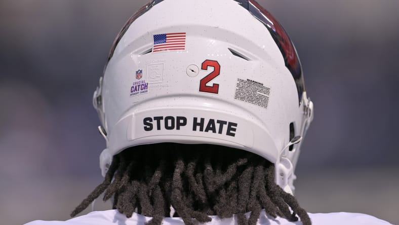 Marquise Brown warms up before a game wearing a Crucial Catch helmet decal at SoFi Stadium. Kyler Murray Vikings