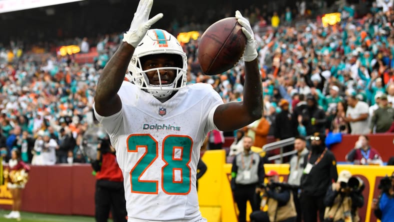 De’Von Achane celebrates a touchdown against the Commanders at FedExField. De’Von Achane Vikings