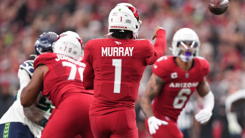 Kyler Murray throws a pass toward James Conner during an Arizona Cardinals game against the Seattle Seahawks. Kyler Murray Vikings