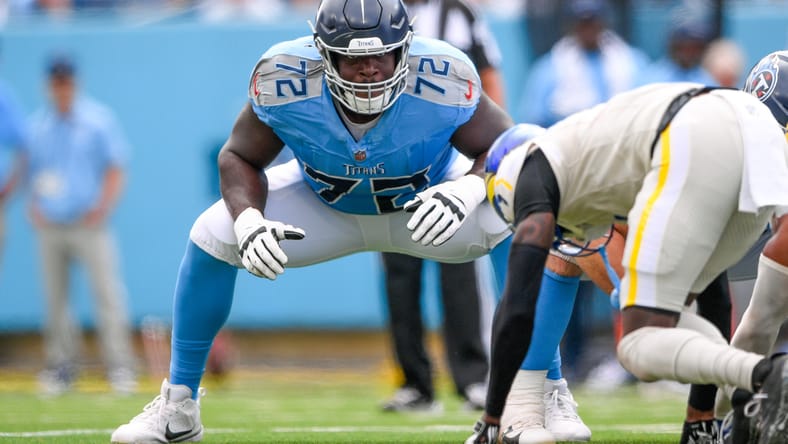 Olisaemeka Udoh blocking for the Titans against the Rams during a game. Oli Udoh Cardinals.