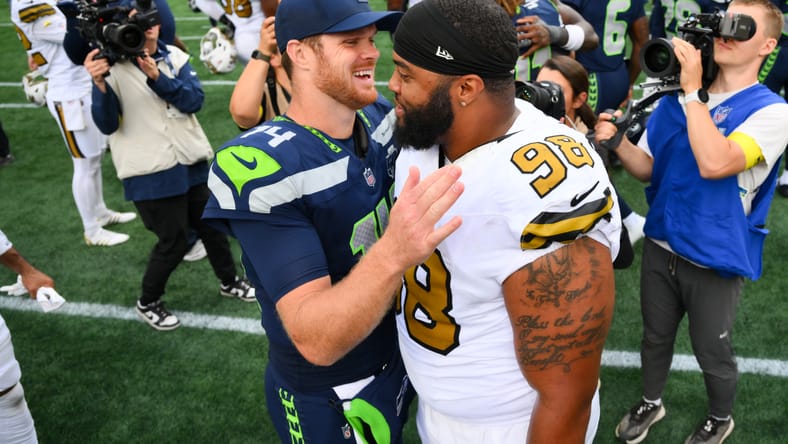 Jonathan Bullard shaking hands with Sam Darnold after a Saints vs Seahawks game. Jonathan Bullard Cowboys.