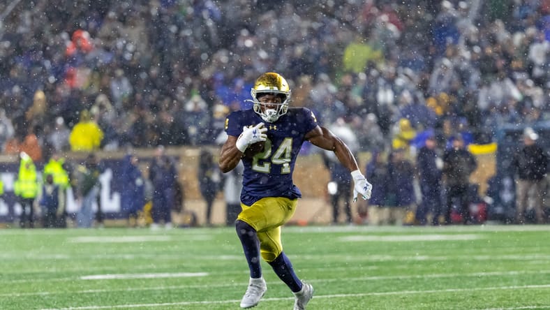 Jadarian Price runs the ball during a game against Navy at Notre Dame Stadium. vikings draft needs 2026