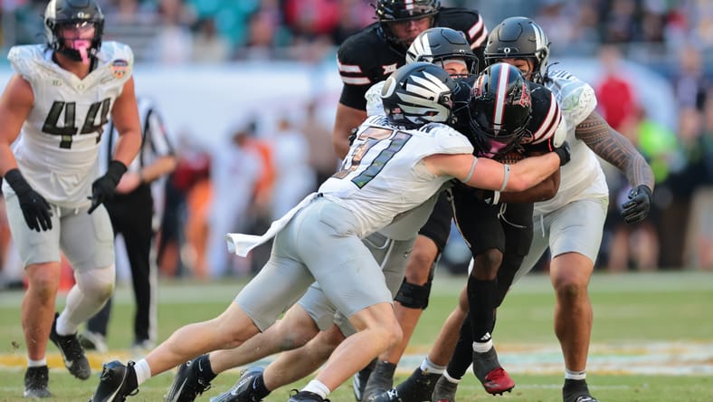 Dillon Thieneman tackling a Texas Tech running back during the Orange Bowl. Dillon Thieneman Vikings.