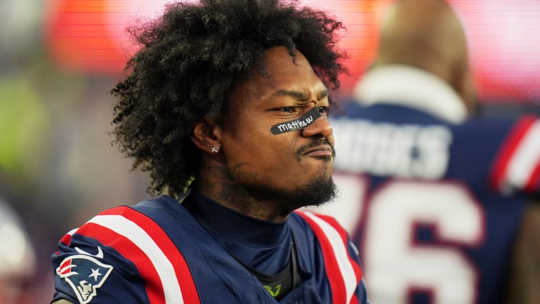 Stefon Diggs stands on the field before a Patriots-Dolphins game at Gillette Stadium. Stefon Diggs Cut Candidate.