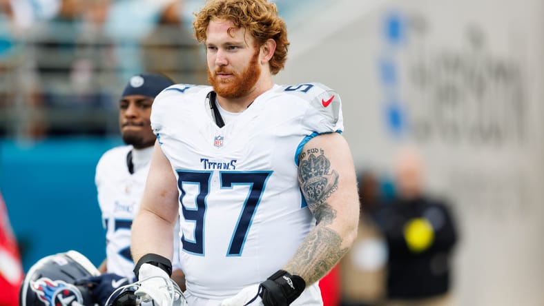 James Lynch standing on the field before Titans vs Jaguars game. James Lynch Bears.