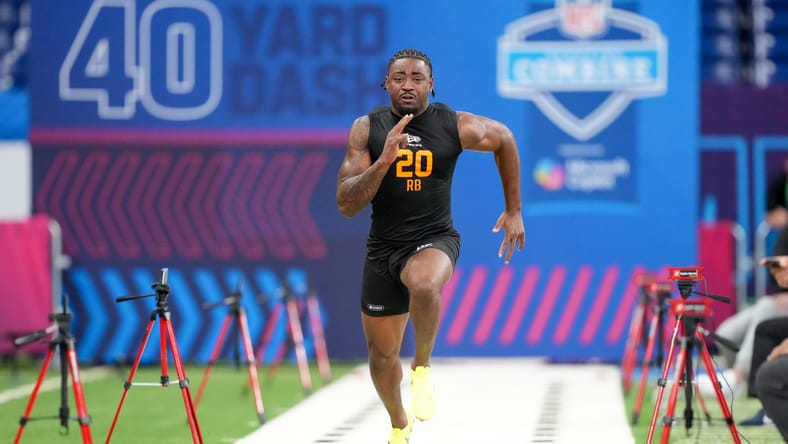 Arkansas running back Mike Washington Jr. participates in drills during the NFL Scouting Combine at Lucas Oil Stadium. Vikings running back draft.