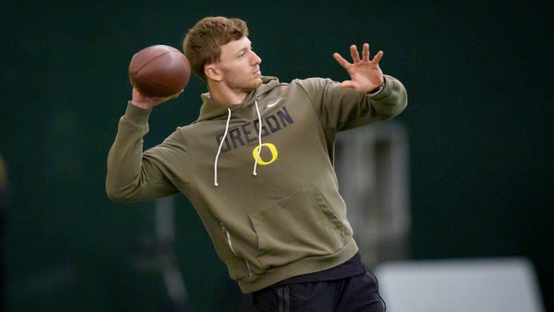 Dillon Thieneman helping a teammate warm up at Oregon Pro Day. Dillon Thieneman Vikings