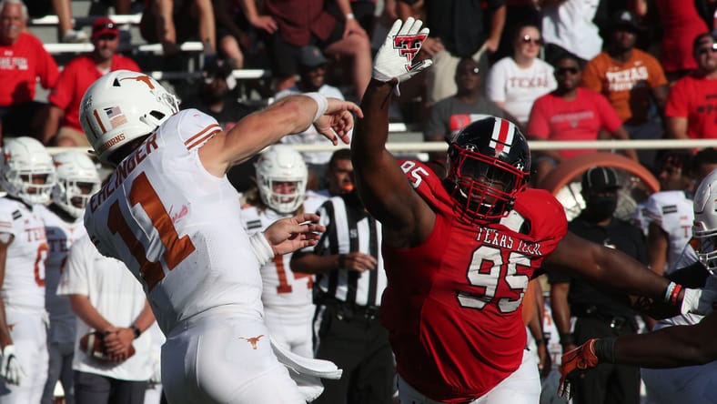 Jaylon Hutchings rushing Sam Ehlinger during Texas Tech vs Texas game. Vikings cut Jaylon Hutchings.