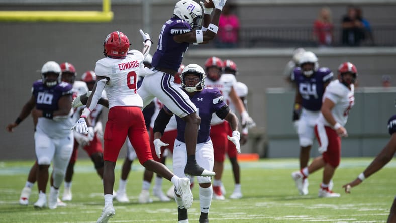 Charles Demmings intercepting a pass during a game between Stephen F. Austin and Jacksonville State.
