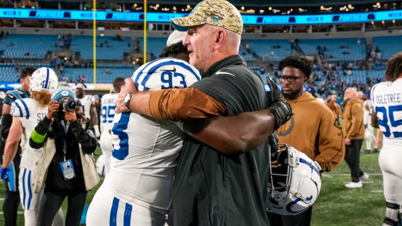 Colts DT Eric Jkhnson hug Frank Reich