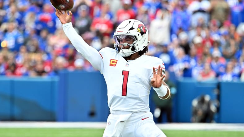 Kyler Murray throws a pass during a Cardinals game against the Bills at Highmark Stadium. kyler murray vikings