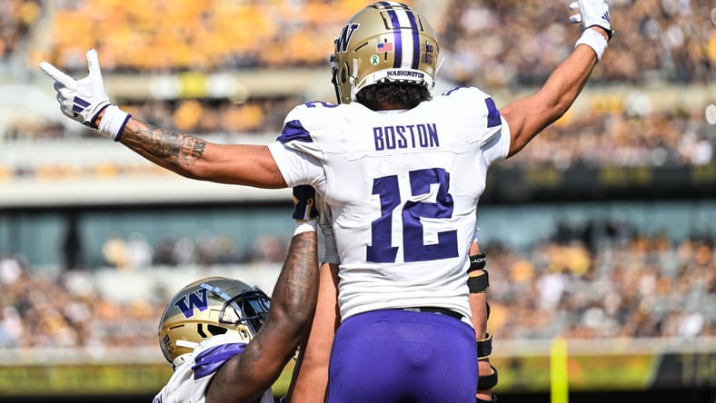 Denzel Boston reacts after catching a touchdown pass against Iowa at Kinnick Stadium. Denzel Boston Vikings