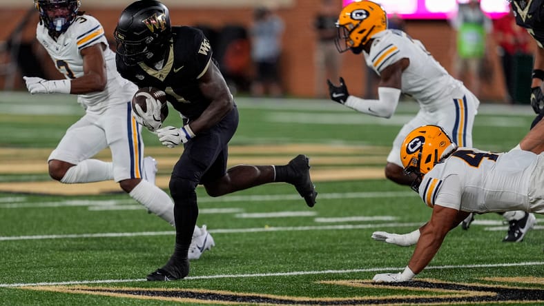 Demond Claiborne runs past a defender against California. Vikings draft