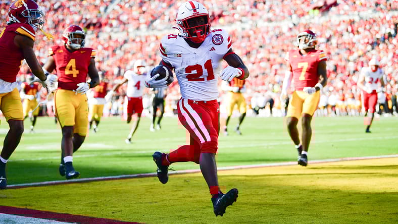 Emmett Johnson scores a touchdown against USC at the goal line. Emmett Johnson Vikings