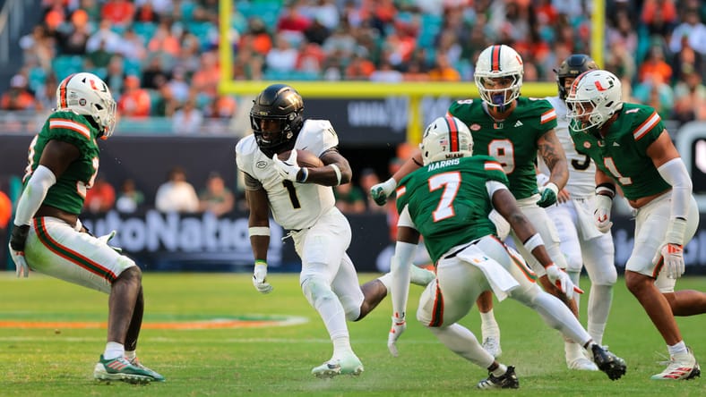 Demond Claiborne runs the ball against Miami during a game at Hard Rock Stadium. Demond Claiborne Vikings