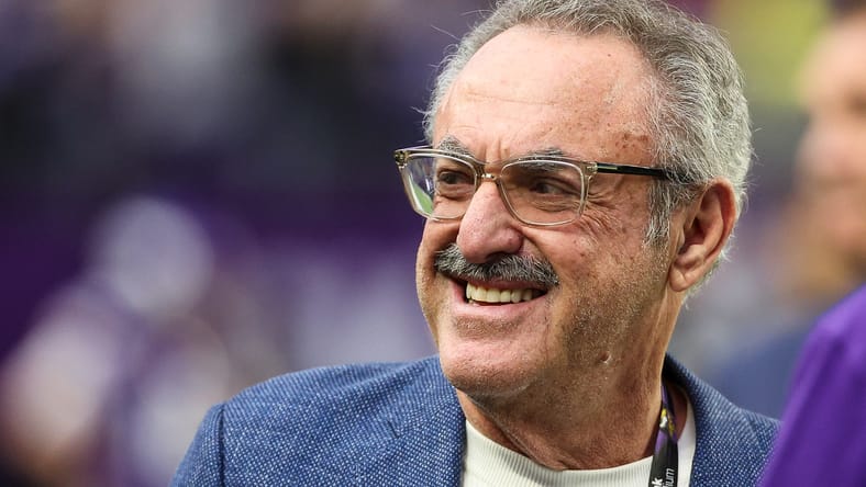 Zygi Wilf standing on the field before a Vikings game at U.S. Bank Stadium.