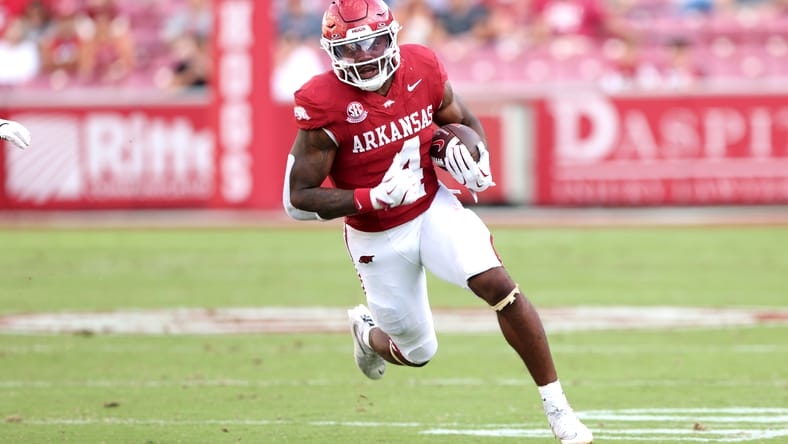 Mike Washington Jr. runs the ball during a game against Alabama A&M. Mel Kiper Vikings mock draft