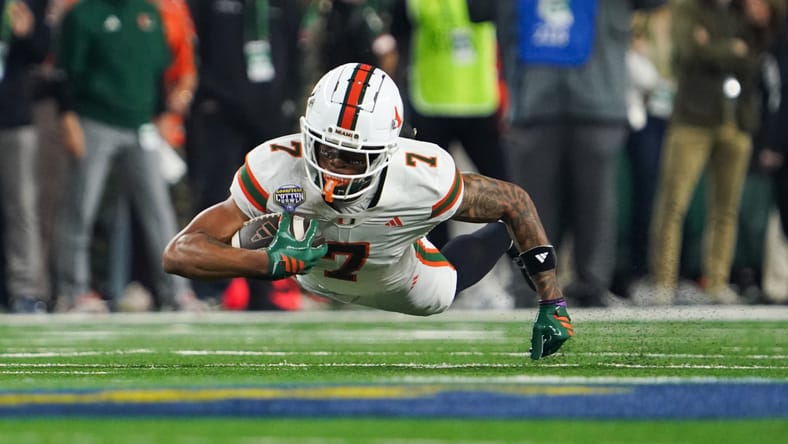 CJ Daniels dives for a first down during a College Football Playoff game. Vikings CJ Daniels.