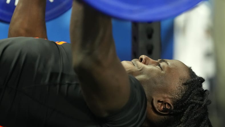 Emmett Johnson performs the bench press at the NFL Combine. Emmett Johnson Vikings