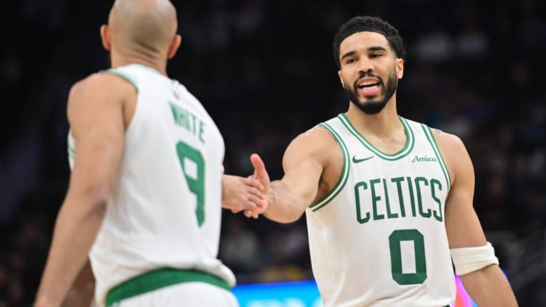 Jayson Tatum and Derrick White react after a basket against the Bucks at Fiserv Forum. nba playoff predictions 2026