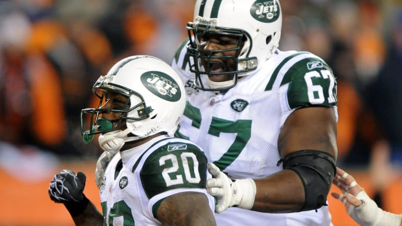 Thomas Jones celebrates with Damien Woody after scoring a touchdown in a playoff game against Cincinnati. J.J. McCarthy