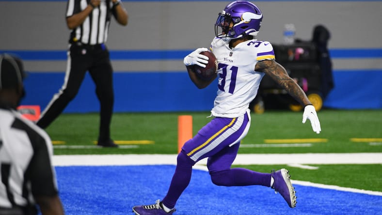 Ameer Abdullah scores a touchdown during a Vikings game against the Detroit Lions at Ford Field.