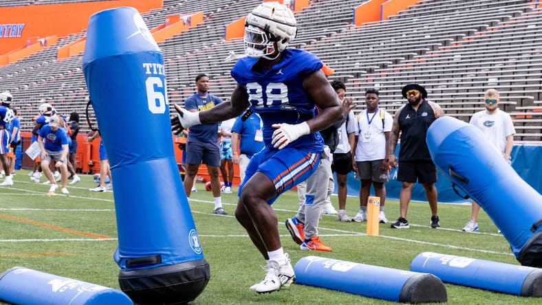 Caleb Banks participates in a defensive line drill during Florida spring football practice in Gainesville. Vikings summer drama