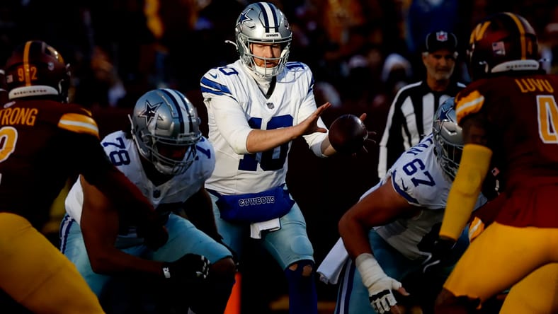 Cooper Rush prepares for a snap during a Cowboys game against the Commanders in Landover.