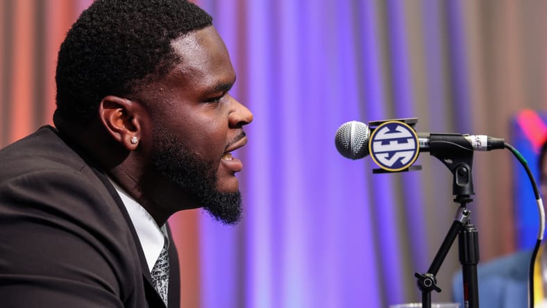 Caleb Banks answers questions from reporters during SEC Media Days in Atlanta. Caleb Banks injury