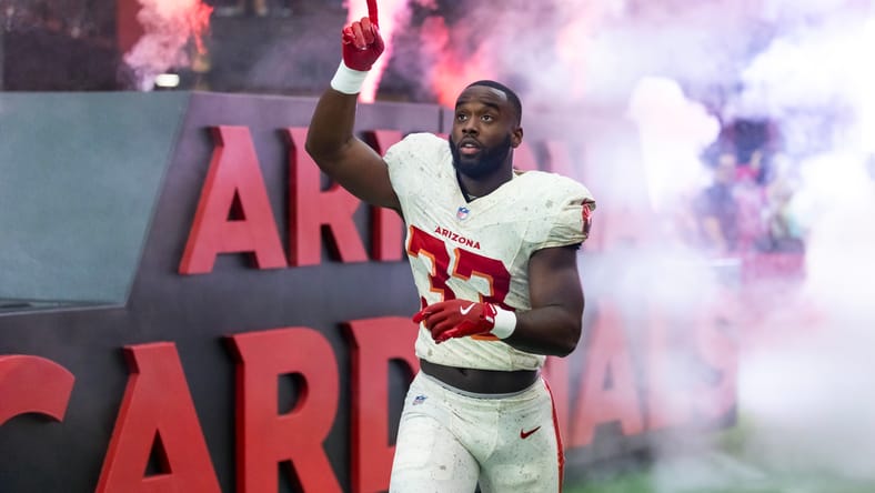 Trey Benson runs the ball against the Seahawks in Arizona. Vikings trades