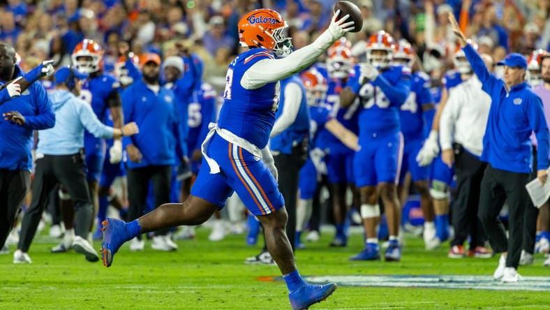 Caleb Banks celebrates after recovering a fumble during a Florida-Florida State game in Gainesville. Vikings rumors