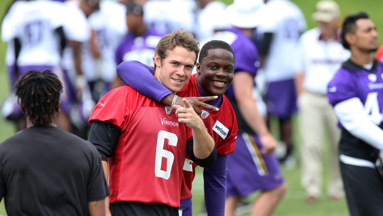 Teddy Bridgewater and Taylor Heinicke react together following Vikings minicamp practice in Minneapolis.