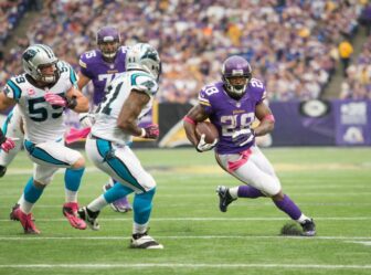 Adrian Peterson carries the ball against the Carolina Panthers.