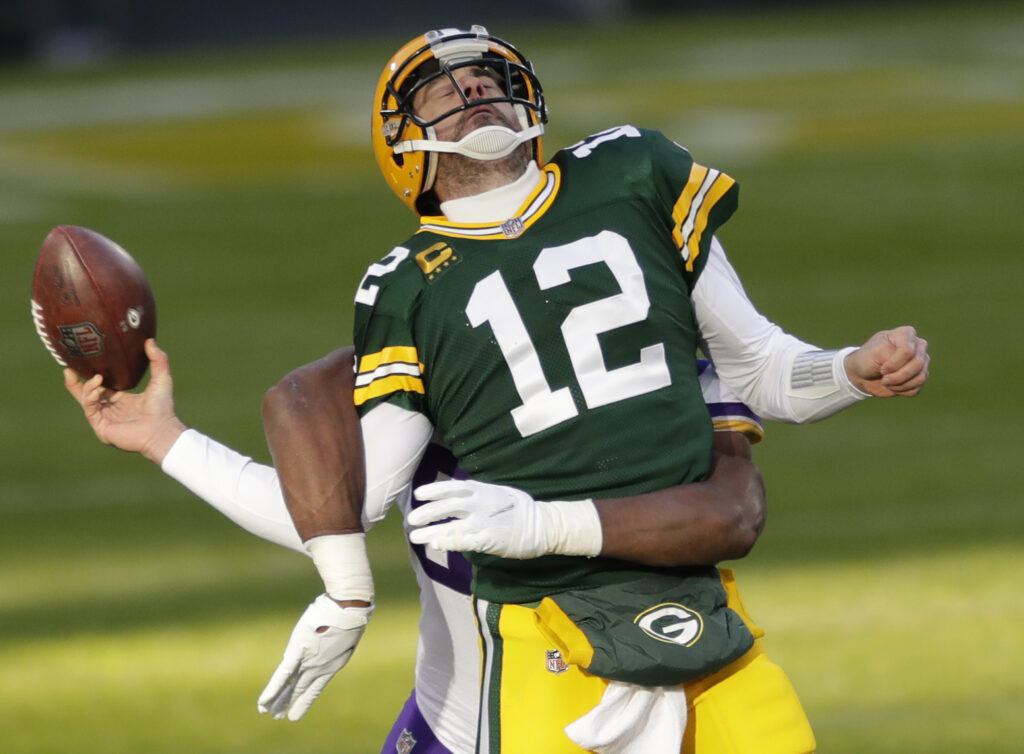 Aaron Rodgers and D.J. Wonnum