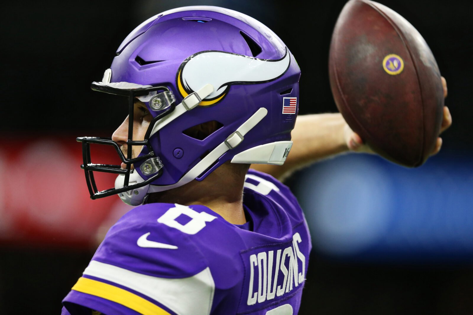 Minnesota Vikings quarterback Kirk Cousins (8) looks to hand off the ball  during an NFL match between Minnesota Vikings and New Orleans Saints at the  Tottenham Hotspur stadium in London, Sunday, Oct.