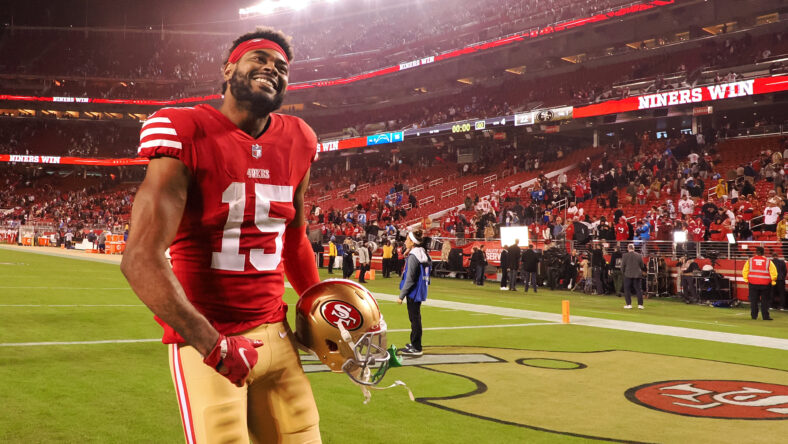 Jauan Jennings of the San Francisco 49ers is congratulated by Deebo