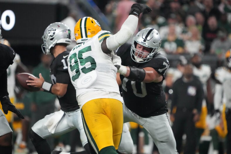 Greg Van Roten blocks Devonte Wyatt during Raiders–Packers action at Allegiant Stadium.