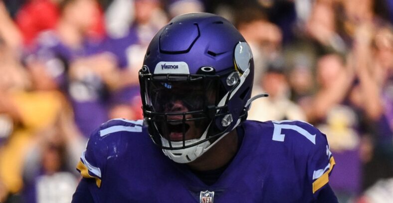 Minnesota Vikings' Dalvin Cook and Christian Darrisaw celebrate touchdown vs. Cardinals.