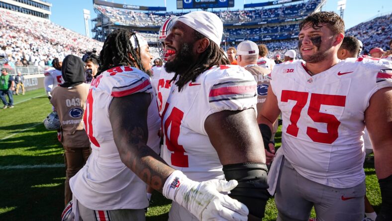 Ohio State’s Donovan Jackson (74) celebrates with teammates after win over Penn State. He nows plays for the Vikings.