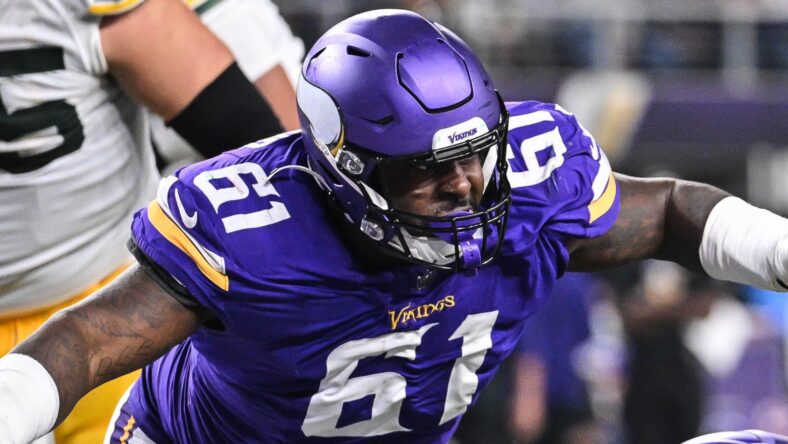 Josh Jacobs scores while Jalen Redmond chases during Vikings-Packers game in 2024.