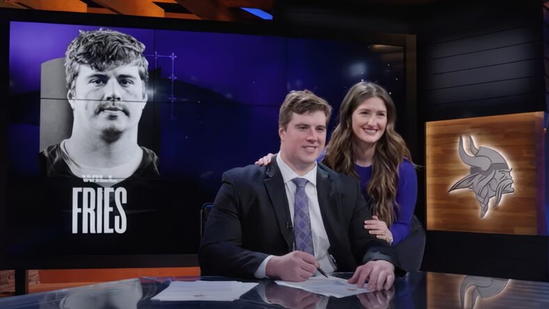 Will Fries signs his contract after joining the Vikings in free agency.