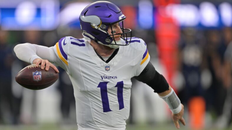Carson Wentz drops back to pass during the Vikings’ first-half matchup against the Chargers at SoFi Stadium.