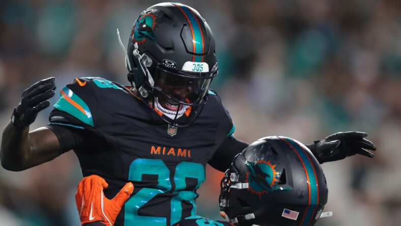 DeโVon Achane celebrates after scoring a touchdown against the Jets during the second half at Hard Rock Stadium.
